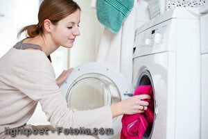 Housework: young woman doing laundry