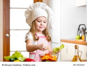 cute girl preparing healthy food vegetable salad